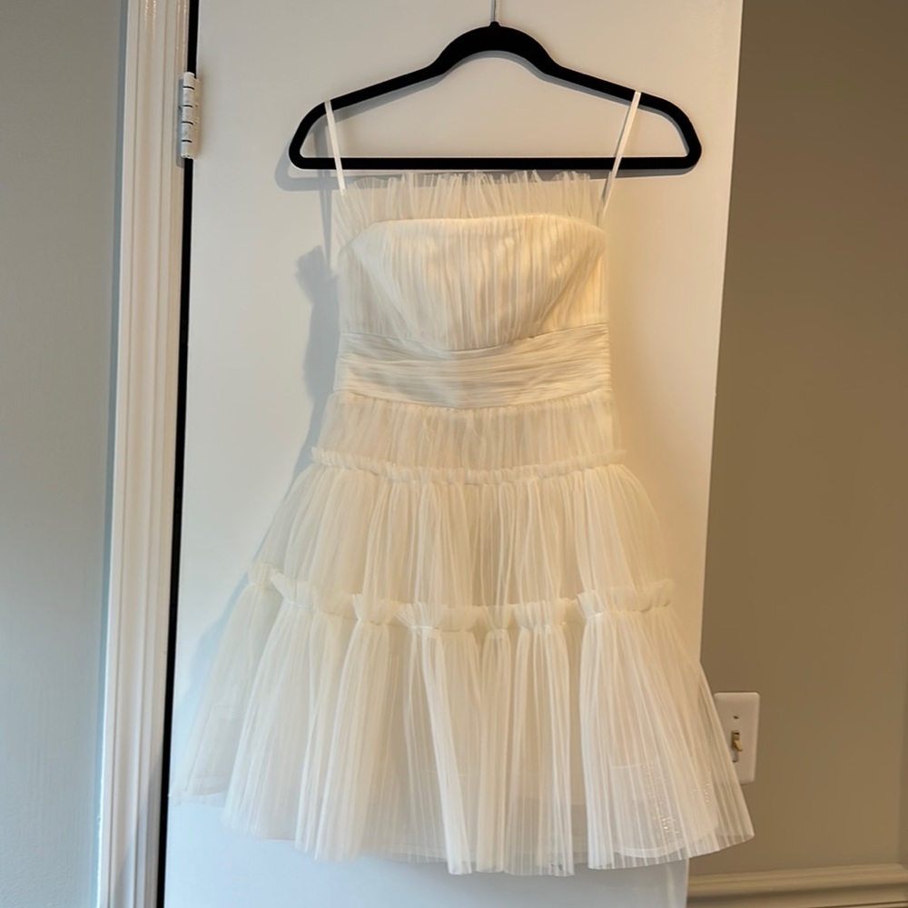 This is a brand new dress, never been worn. It has all the original tags.